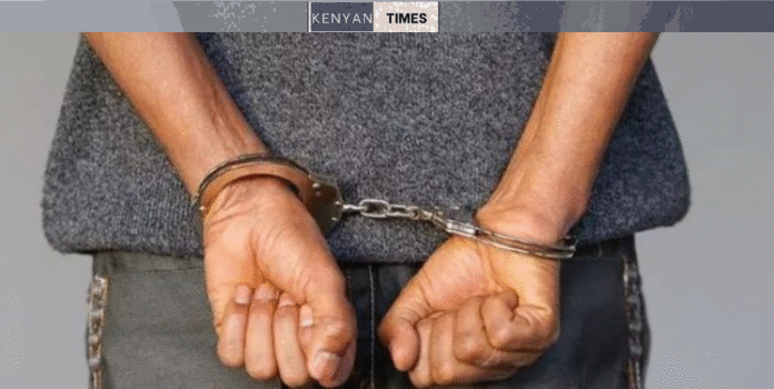 A Suspect Arrested And Put In Handcuffs. Photo/Nation.